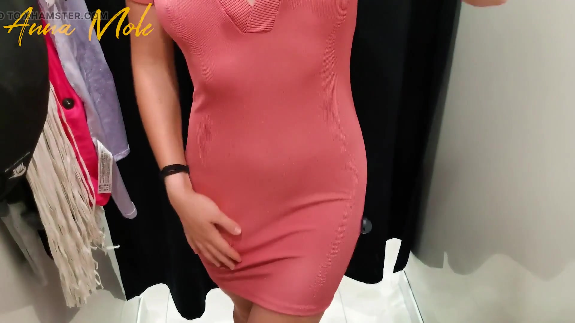 Trying dress in fitting room