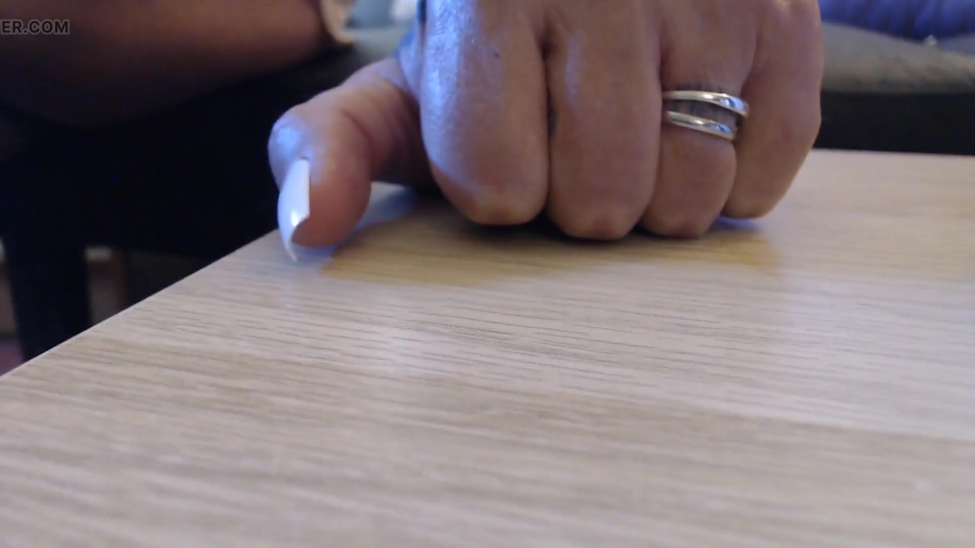 Tapping clicking white fingernails