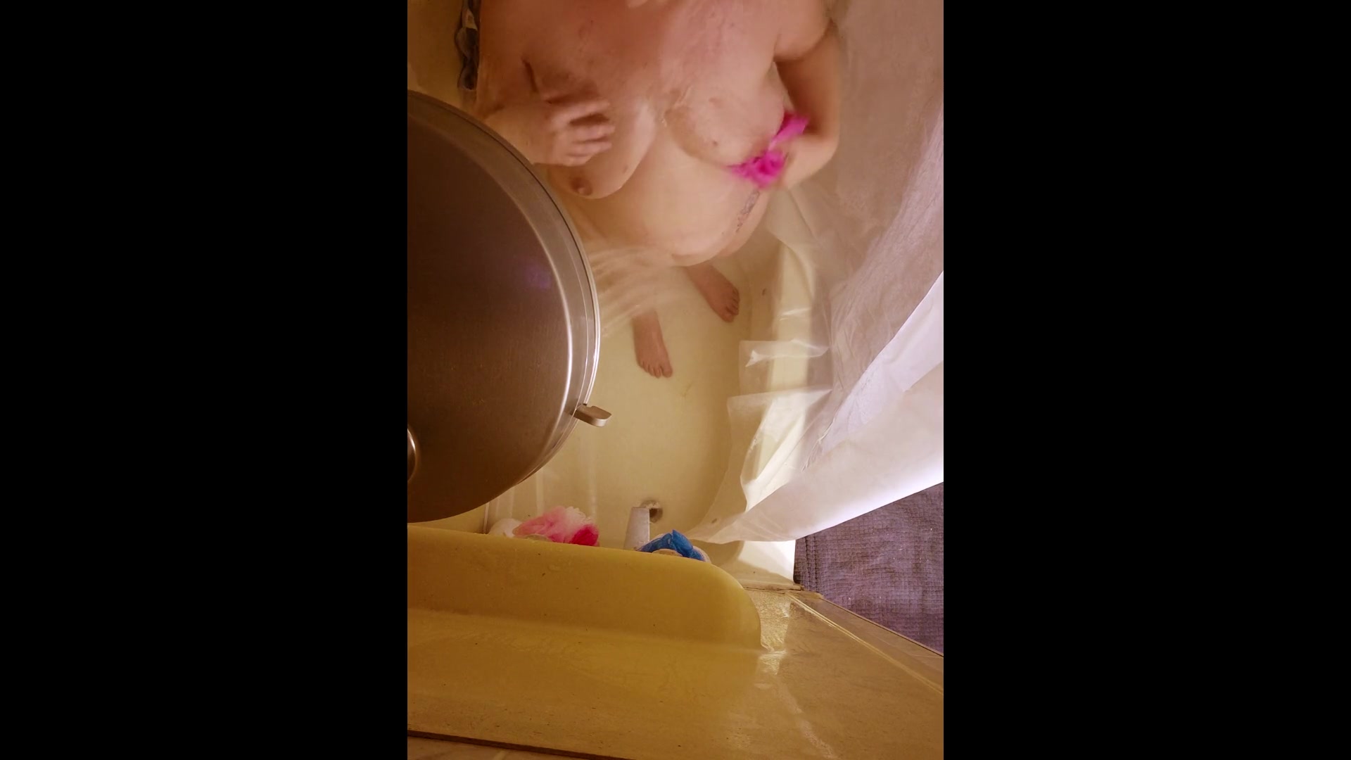 Mature woman taking a shower