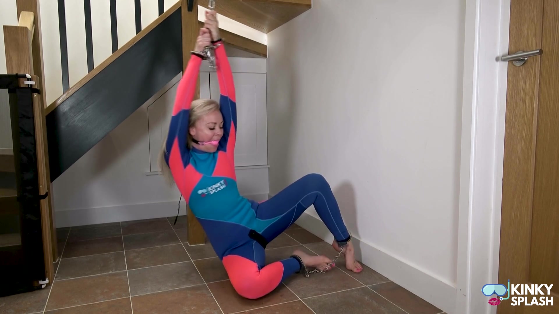 Neoprene Suit, Chains & Face‑cum Tease