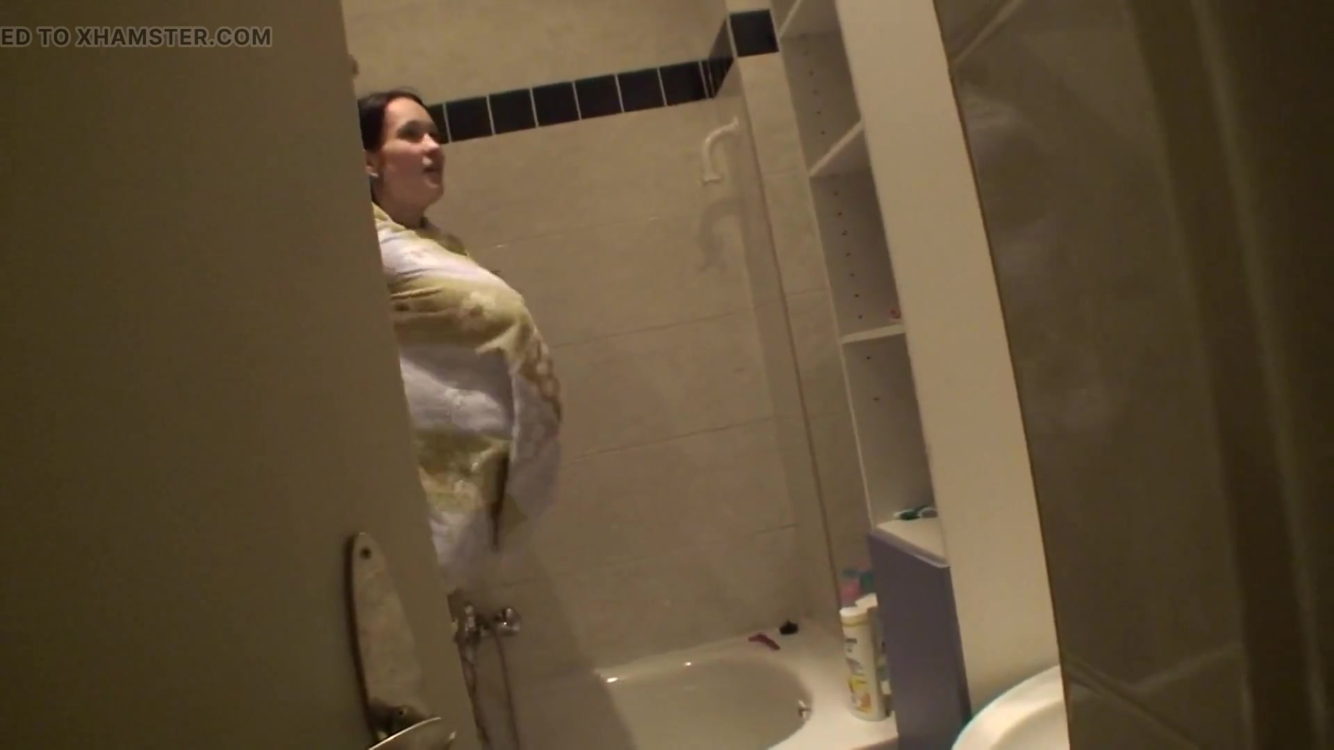 Sexy brunette teen is taking a shower