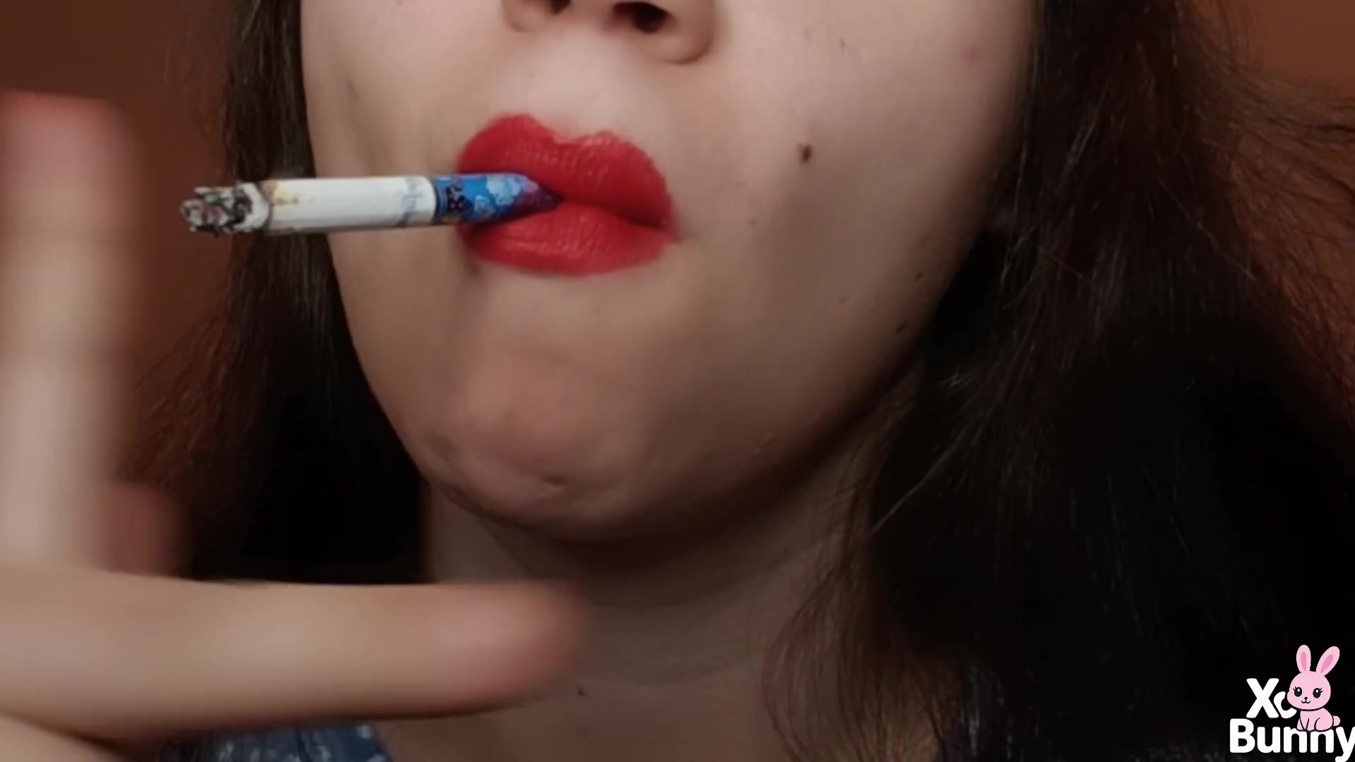 Big red lips smoking close up