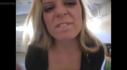 Blonde bitch smoking a cigarette in a close up video