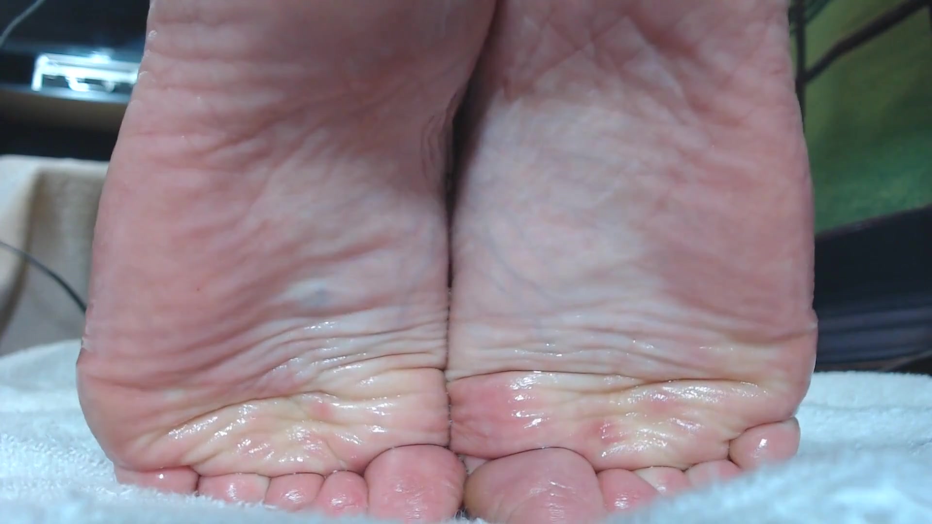 Slick oiled wrinkled soles closeup