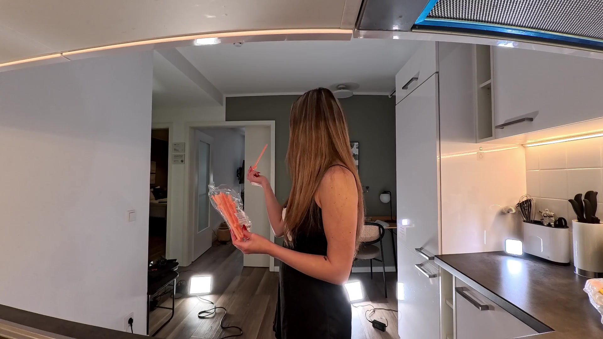 Sexy and hot girl in the kitchen of dormitory only with a nightie gets bored and ignored