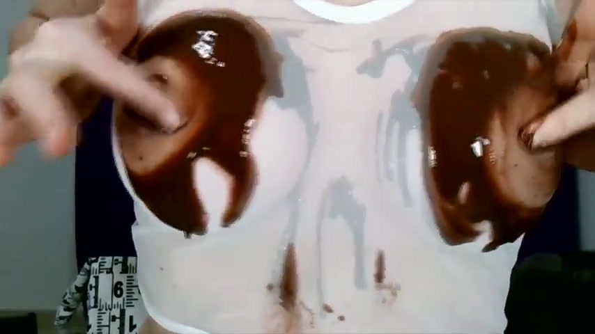 Wetting boobs, tities and nipples with chocolate